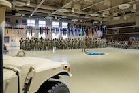 Alaska Army National Guardsmen with Bravo Company, 1st Battalion, 297th Infantry Regiment, and their families are honored during a deployment ceremony at the Alaska National Guard Armory on Joint Base Elmendorf-Richardson, Sept. 29, 2023.