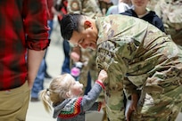 Alaska Army National Guard 1st Sgt. Oliver Meza, Bravo Company first sergeant, shows off his unit’s patch during a deployment ceremony where family members, friends, and fellow Guardsmen came together to pay tribute to Soldiers of B Co., 1st Battalion, 297th Infantry Regiment, at the Alaska National Guard Armory on Joint Base Elmendorf-Richardson, Sept. 29, 2023.