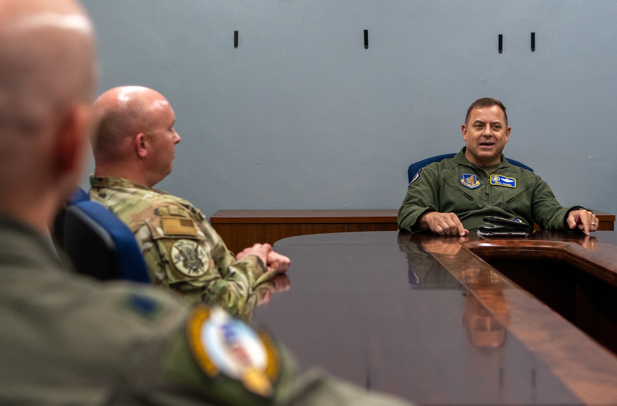 A group sits at a table and talks.