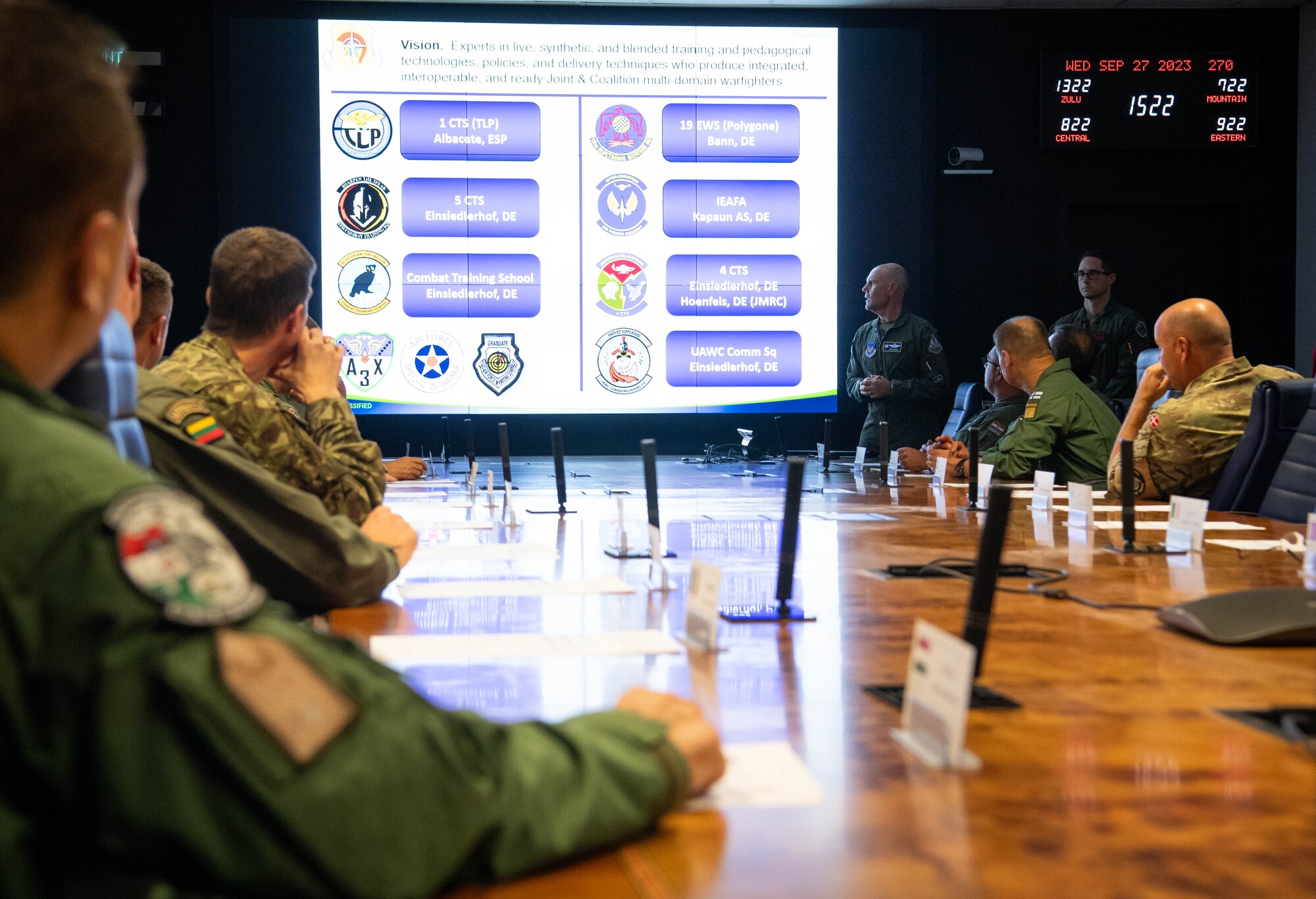 U.S. Air Force Col. Dean Berck, United States Air Forces in Europe, Air Forces Africa Warfare Center (UAWC) commander, provides a mission brief on the UAWC to U.S. Air Force Gen. James B. Hecker, USAFE-AFAFRICA commander, and NATO Air Chiefs at Einsiedlerhof Air Base, Germany, Sept. 27, 2023. The UAWC's mission is to support USAF, Joint, Allied, and partner nation warfighters at the tactical, operational and strategic levels using diverse live, classroom, and modeling and simulation networks. (U.S. Air Force photo by Senior Airman Jared Lovett)