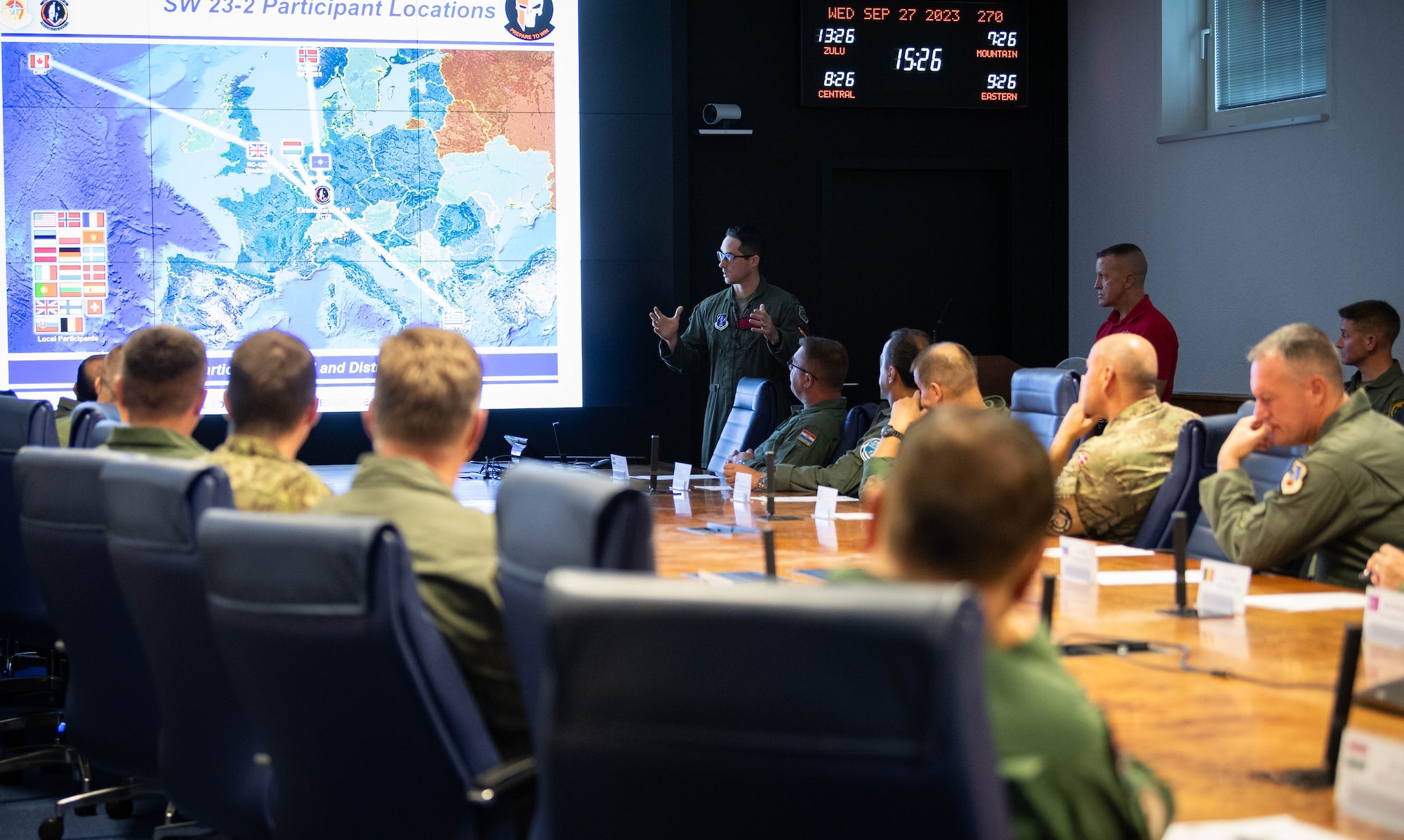 U.S. Air Force Maj. Benjamin Soltis, 5th Combat Training Squadron deputy exercise director, briefs U.S. Air Force Gen. James B. Hecker, United States Air Forces in Europe, Air Forces Africa commander, and NATO Air Chiefs on an upcoming readiness exercise during a tour of the USAFE-AFAFRICA Warfare Center (UAWC), at Einsiedlerhof Air Base, Germany, Sept. 27, 2023. The UAWC is the U.S. Air Force's premiere distributed training center in Europe, providing enhanced joint and combined warfighter readiness training through live, virtual and constructive simulation capabilities. (U.S. Air Force photo by Senior Airman Jared Lovett)