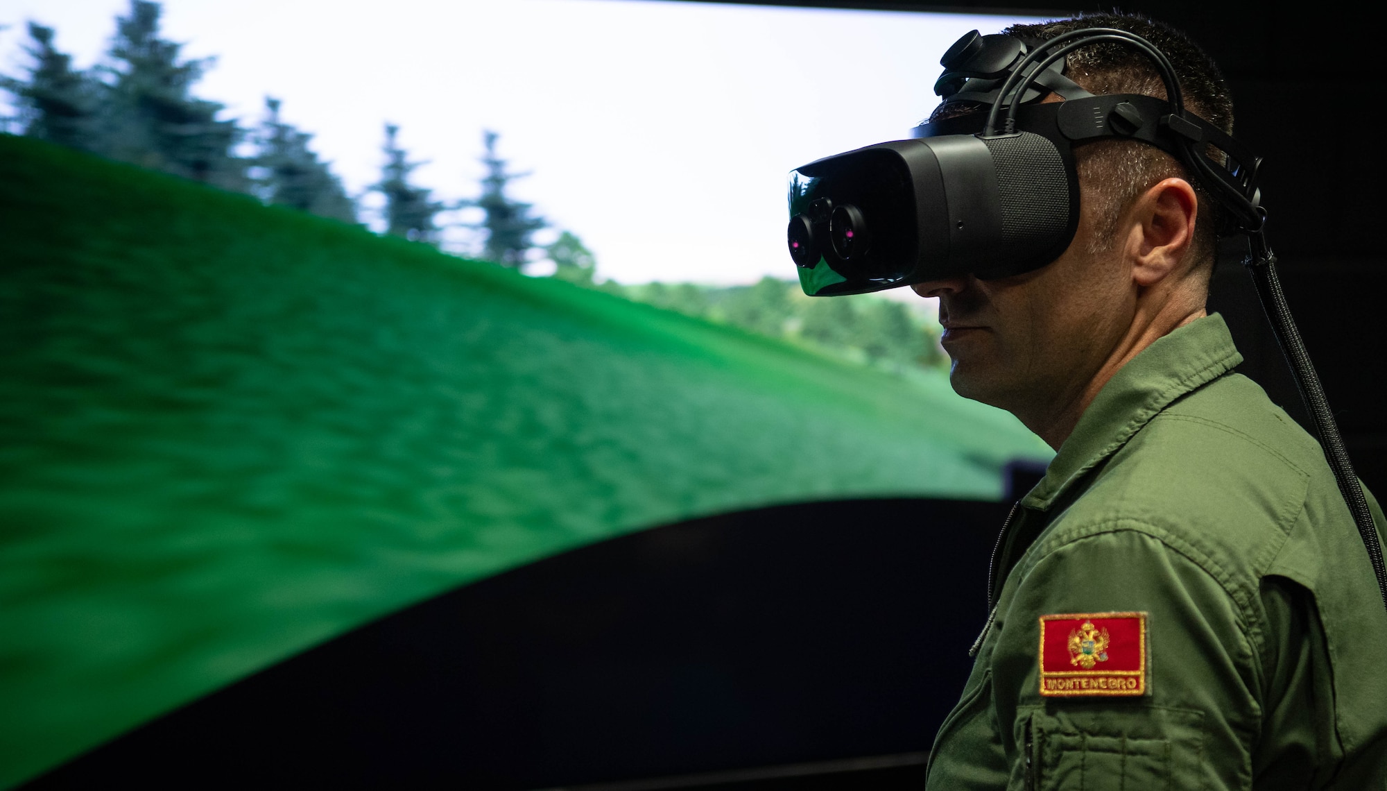 Montenegro Lt. Col. Bojan Popadic, NATO air chief, participates in a Deployable Joint Fires Trainer simulator during a NATO Air Chiefs visit hosted by United States Air Forces in Europe, Air Forces Africa Warfare Center (UAWC) leadership at Einsiedlerhof Air Base, Germany, Sept. 27, 2023. The UAWC is a multifaceted organization that enhances warfighter readiness across the European theater. (U.S. Air Force photo by Senior Airman Jared Lovett)