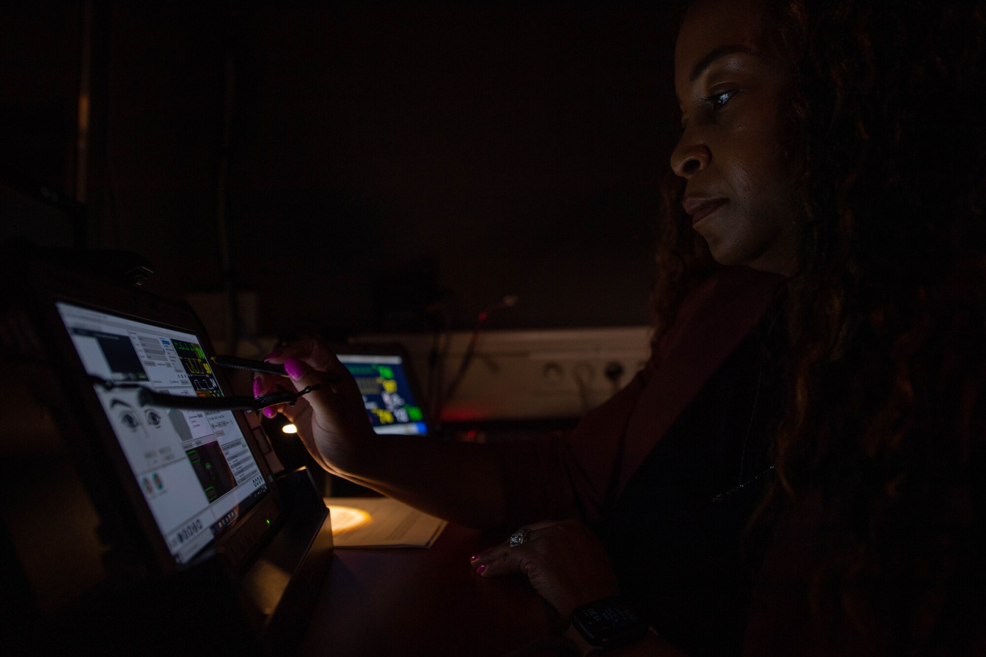 Brenda Robinson, 86th Aeromedical Evacuation Squadron, Air Force Medical Modeling and Simulation Training healthcare simulation operations specialist, interacts with a control tablet during the interactive portion of clinical simulator training at Ramstein Air Base, Germany, Aug. 1, 2023.
