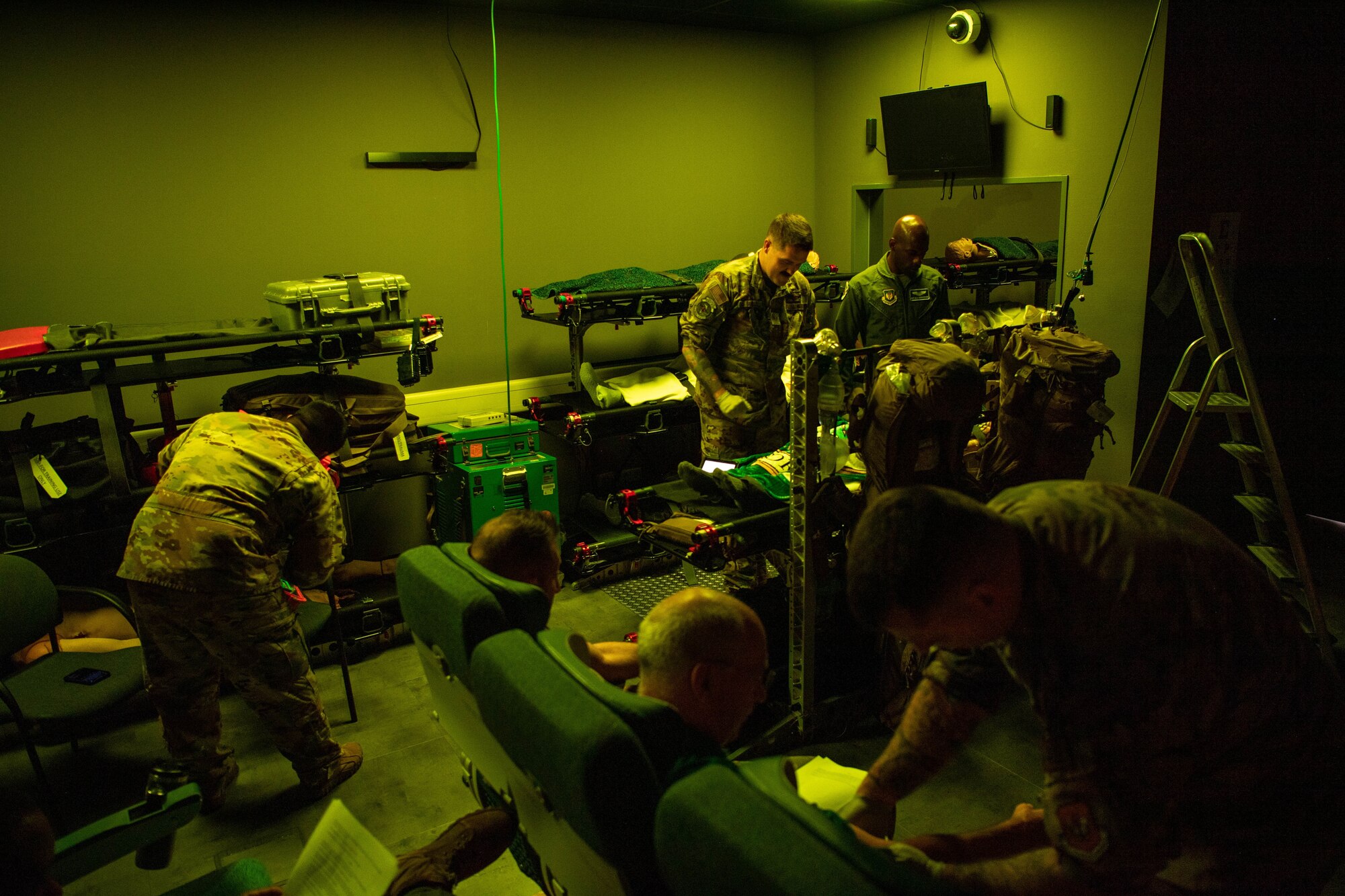 U.S. Air Force aeromedical evacuation technicians and a nurse treat volunteer patients and a robotic mannequin during clinical simulator training at Ramstein Air Base, Germany, Aug. 1, 2023.