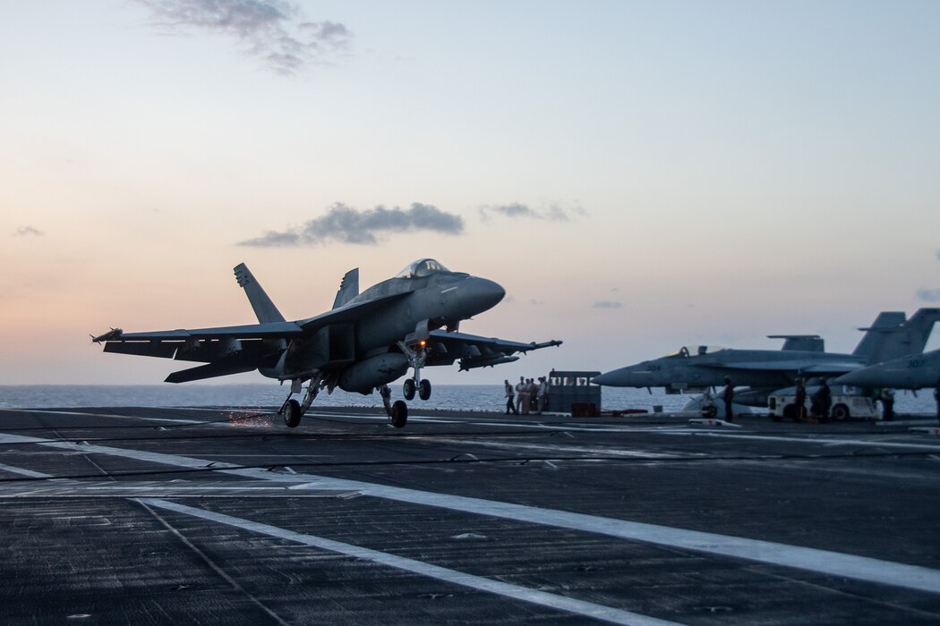 An F/A-18E Super Hornet from VFA-195 lands aboard USS Ronald Reagan (CVN 76) during flight operations in the Philippine Sea.