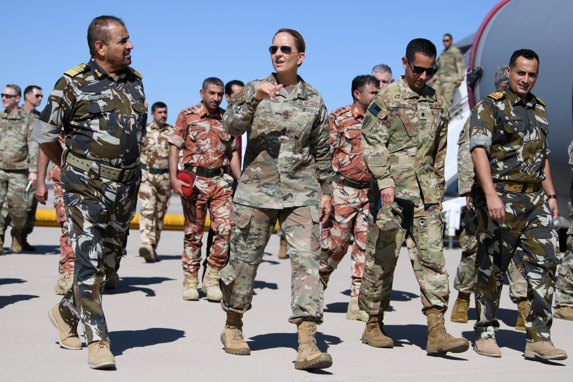 Maj. Gen. Kerry L. Muehlenbeck, adjutant general of Arizona, and director of the Arizona Department of Emergency and Military Affairs, walks with the Sultanate of Oman’s Vice Admiral Abdullah Al Raisi, chief of staff of the Sultan’s Royal Forces, and other military officials during a tour of Goldwater Air National Guard Base in Phoenix Sept. 25, 2023. The Sultanate of Oman and Arizona became partners under the Department of Defense National Guard Bureau State Partnership Program last year.