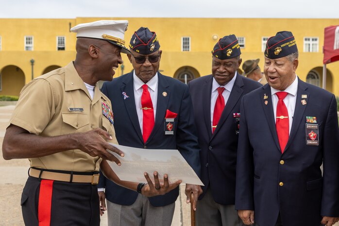 U.S. Marine Corps Brig. Gen. James A. Ryans II, commanding general of Marine Corps Recruit Depot San Diego and the Western Recruiting Region and Montford Point Marines from the MPM Association, Chapter 44, observe an award and honors ceremony at Marine Corps Recruit Depot San Diego, Sept. 28, 2023. The Congressional Gold Medal was presented to Robin Rayford on behalf of her father, Master Sgt. Robert Lee Crittenden, who served in the Marine Corps from February 1946 to March 1965, making history as one of the 20,000 African Americans trained to become Marines at Montford Point Camp, located in Camp Lejeune, North Carolina. (U.S. Marine Corps photo by Cpl. Alexander O. Devereux)