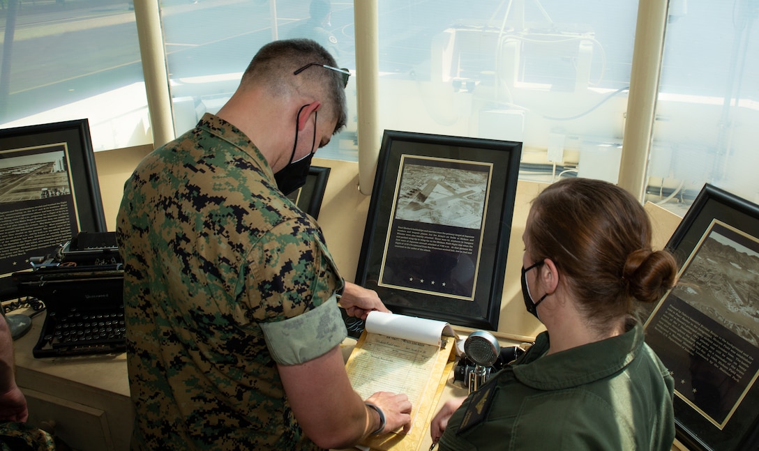 U.S. Marine Corps Maj. Michael Kingen, Lt. Col. Justin Carlson, Col. Benjamin W. Malmanger, Lt. Col. Eileen C. Donovan, Lt. Col. Joseph R. Fuller, Capt. Nicholas M.B. Patinos, Lt. Col. Joseph R. Faller, and Capt. Jeffrey C. Abercrombie, all gather in front of the Hickam Flag that was flown on Dec. 7, 1941 for a group photo in support of Keen Edge at Joint Base Pearl Harbor-Hickam, Hawaii, Feb. 1, 2022. Exercise Keen Edge is a joint, bilateral command post exercise designed to facilitate interaction between and improve the interoperability of U.S. Forces and the Japan Self-Defense Forces. Keen Edge proves our ability to effectively and mutually respond to a regional crisis situation that might have direct and immediate impact on both countries. The U.S. and Japan Alliance is the cornerstone of peace and security in the Indo-Pacific, supporting a rules-based international order that promotes regional stability and prosperity.  (U.S. Marine Corps photo by Cpl. Benjamin M. Whitehurst)