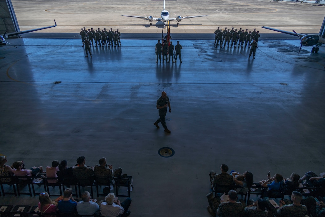 Lt. Col.William T. Graves Jr., incoming commander of Marine Transport Squadron (VMR) Belle Chasse, delivers a speech during his change of command ceremony at a VMR Hangar, Naval Air Station Joint Reserve Base, Belle Chasse, La. on June 2, 2023.