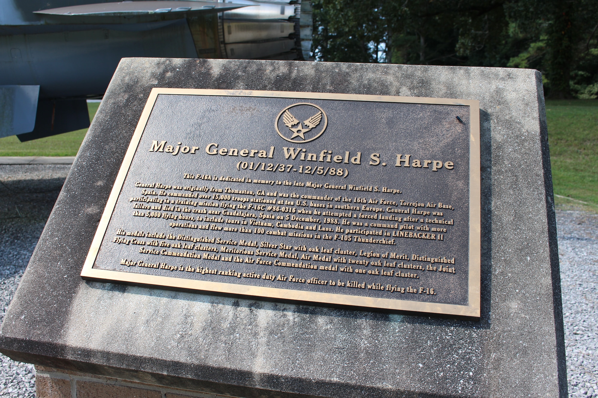 This plaque is located next to the static F-16 Fighting Falcon on display outside Gate 2 at Arnold Air Force Base, Tenn. The display is dedicated to Maj. Gen. Winfield Harpe. He was killed on Dec. 5, 1988, when the aircraft he was piloting crashed during a training mission in Madrid, Spain. The display was dedicated in memory of Harpe during a June 26, 2010, ceremony. (U.S. Air Force photo by Kali Bradford)