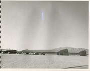 East classrooms, from the Southeast looking Northwest, undated. Note the fence added after original construction.