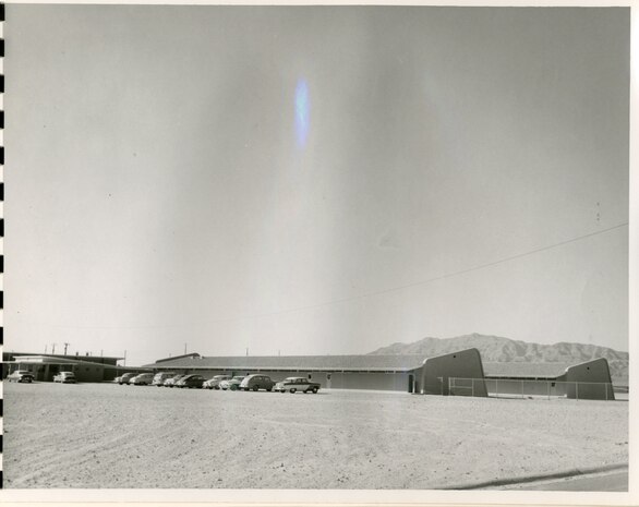 East classrooms, from the Southeast looking Northwest, undated. Note the fence added after original construction.