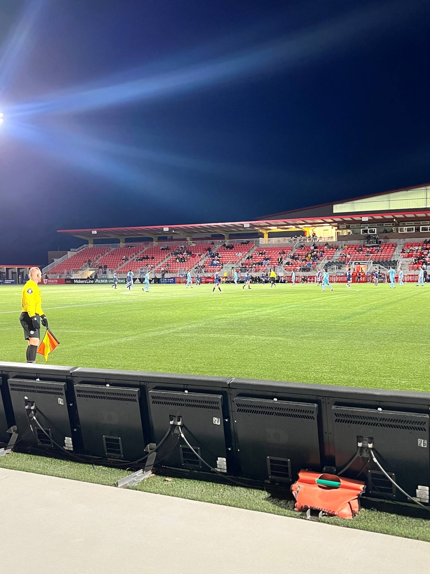 a soccer stadium with people sitting in the stands