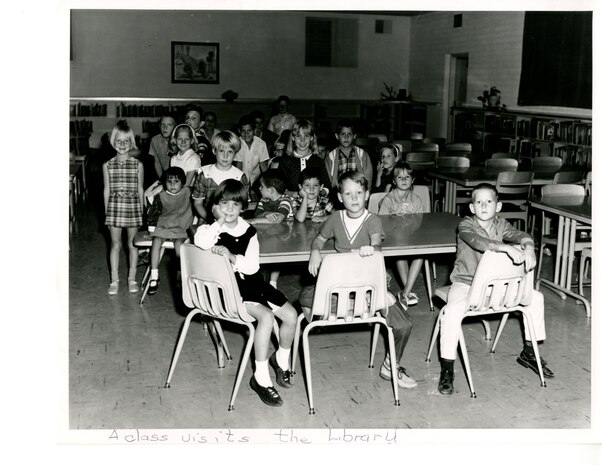 Students visit the school library, undated.