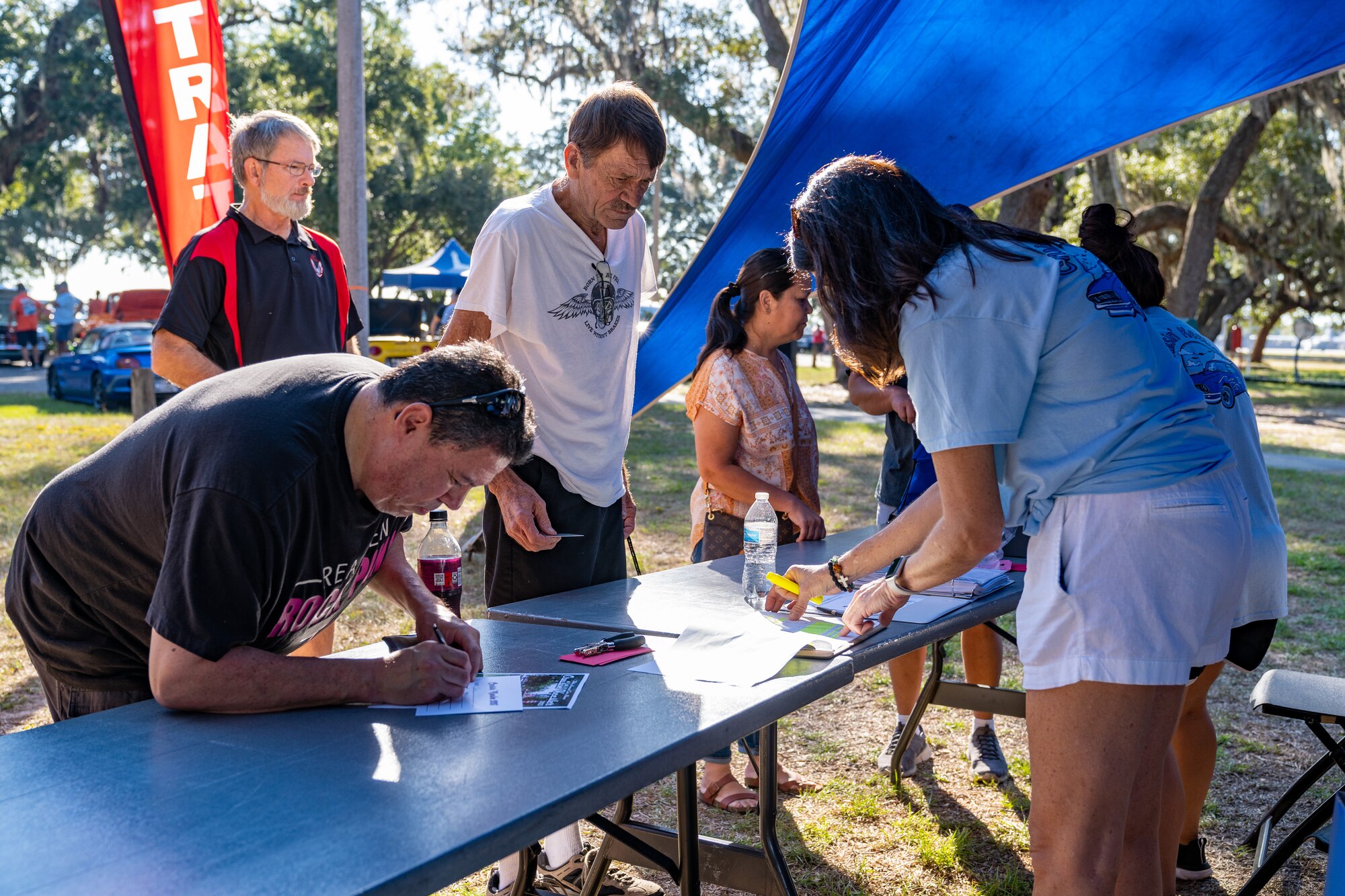 Cruisers register their cars for the 2023 Cruisin' Keesler competition at Keesler Air Force Base, Mississippi, Sept. 30, 2023.