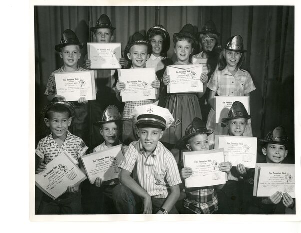 Students holding Fire Prevention Week awards, October 1964.