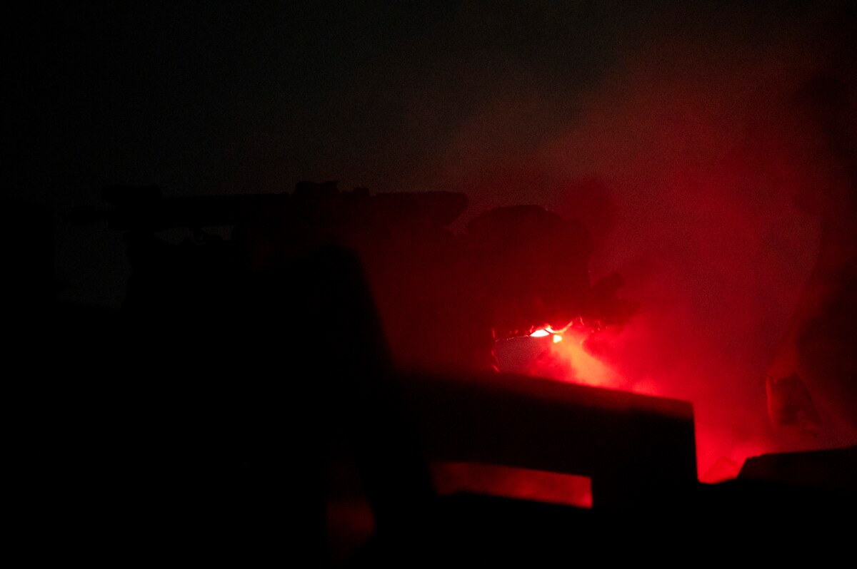 A U.S. Airman, training with the 68th Rescue Squadron, searches for simulated casualties trapped in a vehicle during a training exercise at Davis-Monthan Air Force Base, Ariz., Aug. 23, 2023. The Airman removed sheet metal from the top of the vehicle before locating and rescuing the casualties. (U.S. Air Force photo by Airman 1st Class William Finn V)