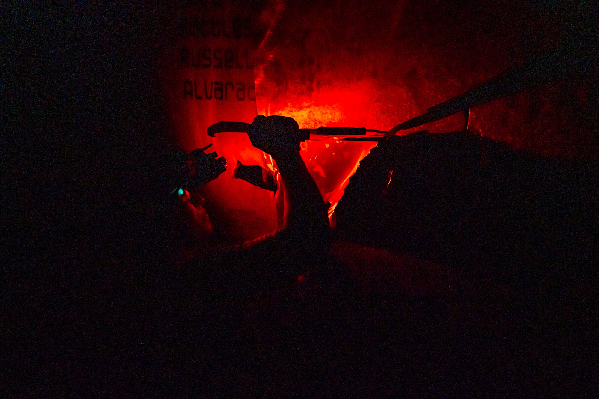 A U.S. Airman, training with the 68th Rescue Squadron, cuts open sheet metal to gain access to the inside of a simulated HC-130 Combat King II aircraft crash at Davis-Monthan Air Force Base, Ariz., Aug. 23, 2023. The exercise tested the Airman’s search and rescue abilities. (U.S. Air Force photo by Airman 1st Class Devlin Bishop)