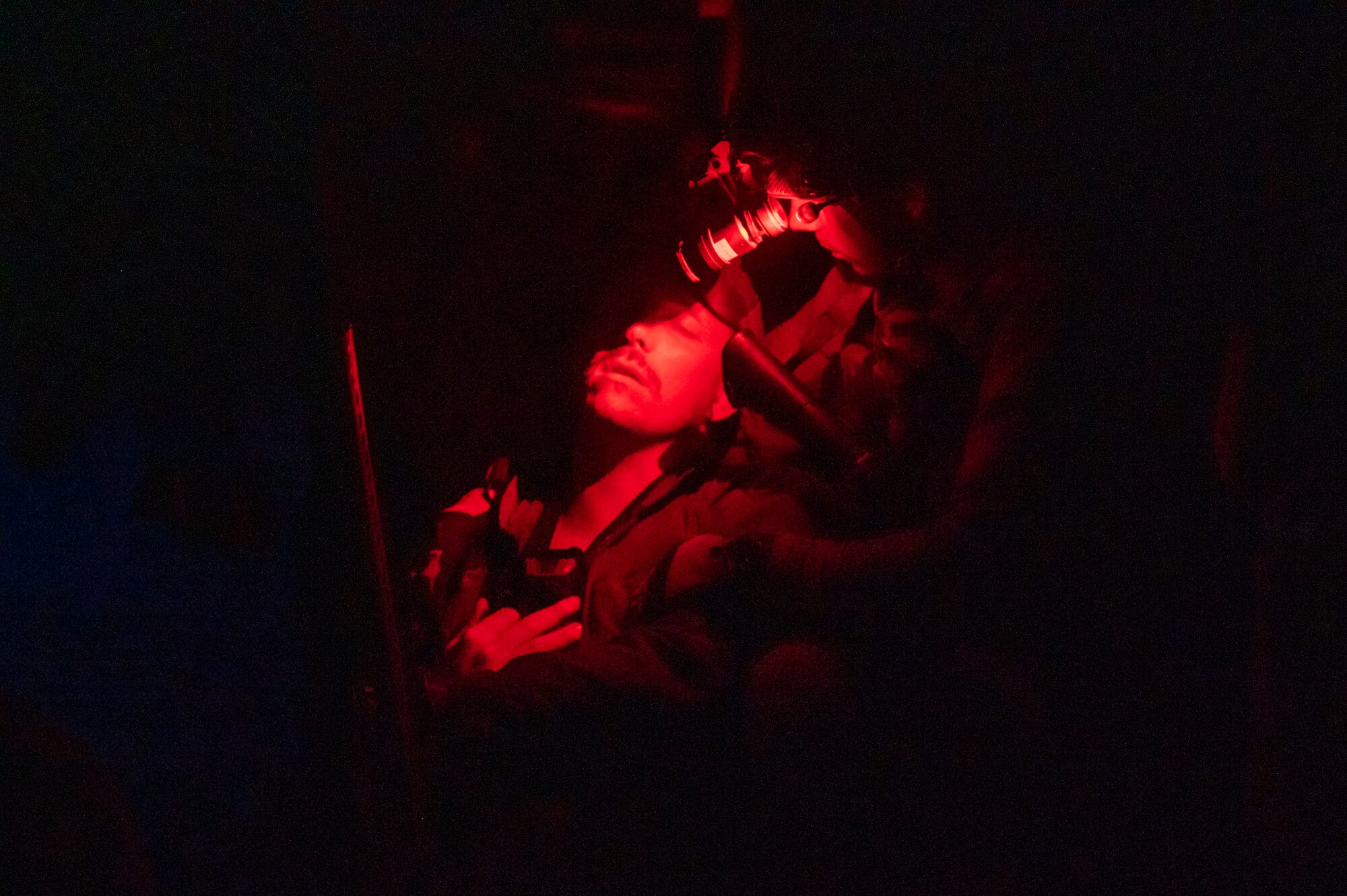 A U.S. Airman, training with the 68th Rescue Squadron, assists a simulated casualty during the Combat Leader Course at Davis-Monthan Air Force Base, Ariz., Aug. 23, 2023. The exercise required the students to find casualties and treat their injuries. (U.S. Air Force photo by Airman 1st Class Devlin Bishop)
