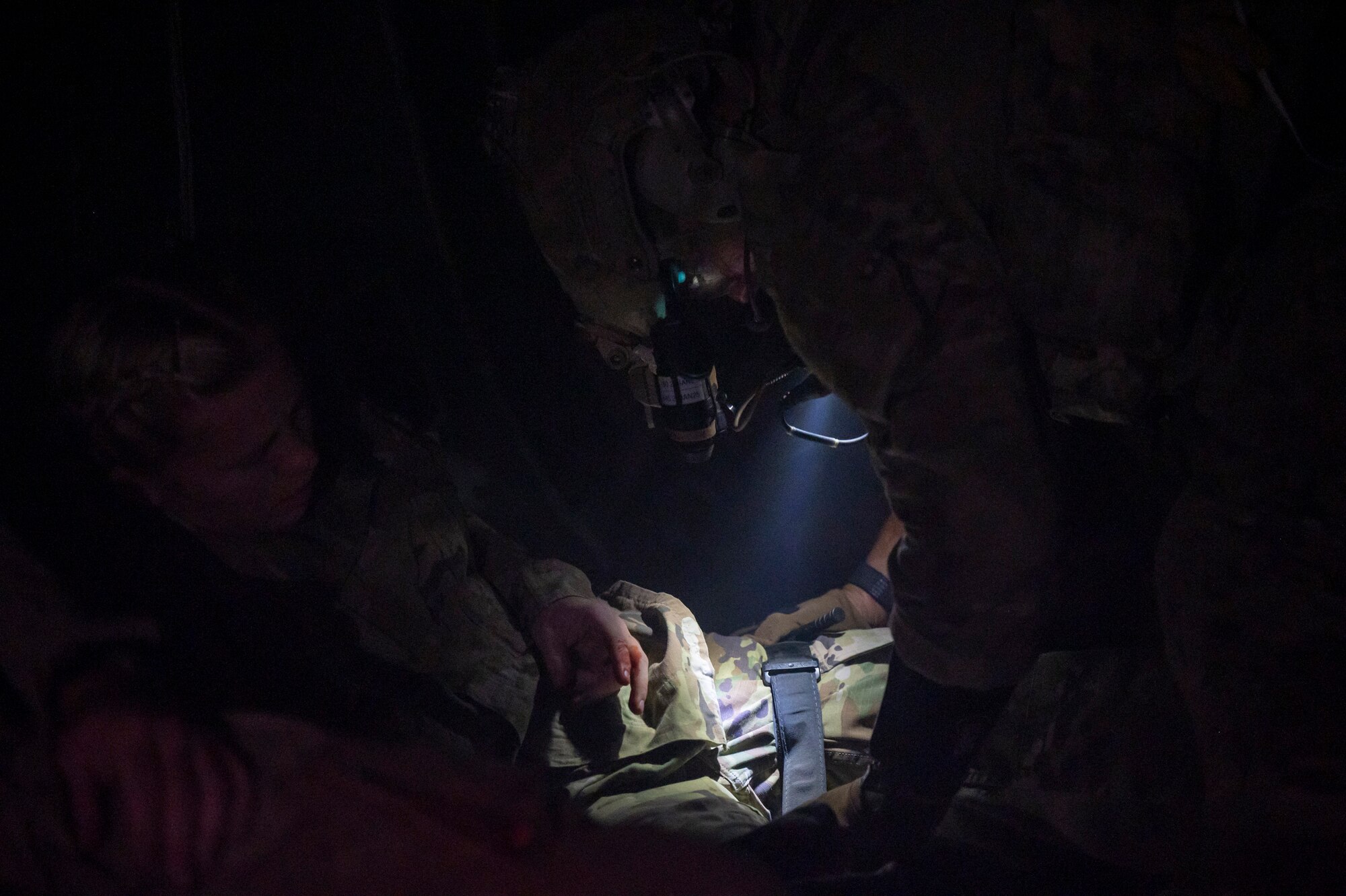 A U.S. Airman, training with the 68th Rescue Squadron, tends to a simulated casualty during the Combat Leader Course at Davis-Monthan Air Force Base, Ariz., Aug. 23, 2023. The Airman applied a tourniquet to stop the casualty’s simulated bleeding. (U.S. Air Force photo by Airman 1st Class Devlin Bishop)