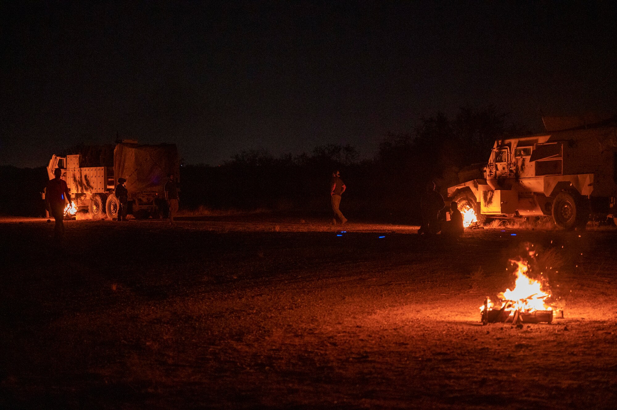 U.S. Airmen prepare for a 68th Rescue Squadron exercise to begin during the Combat Leader Course at Davis-Monthan Air Force Base, Ariz., Aug. 24, 2023. The exercise involved multiple vehicles with simulated casualties trapped inside. (U.S. Air Force photo by Airman 1st Class Devlin Bishop)