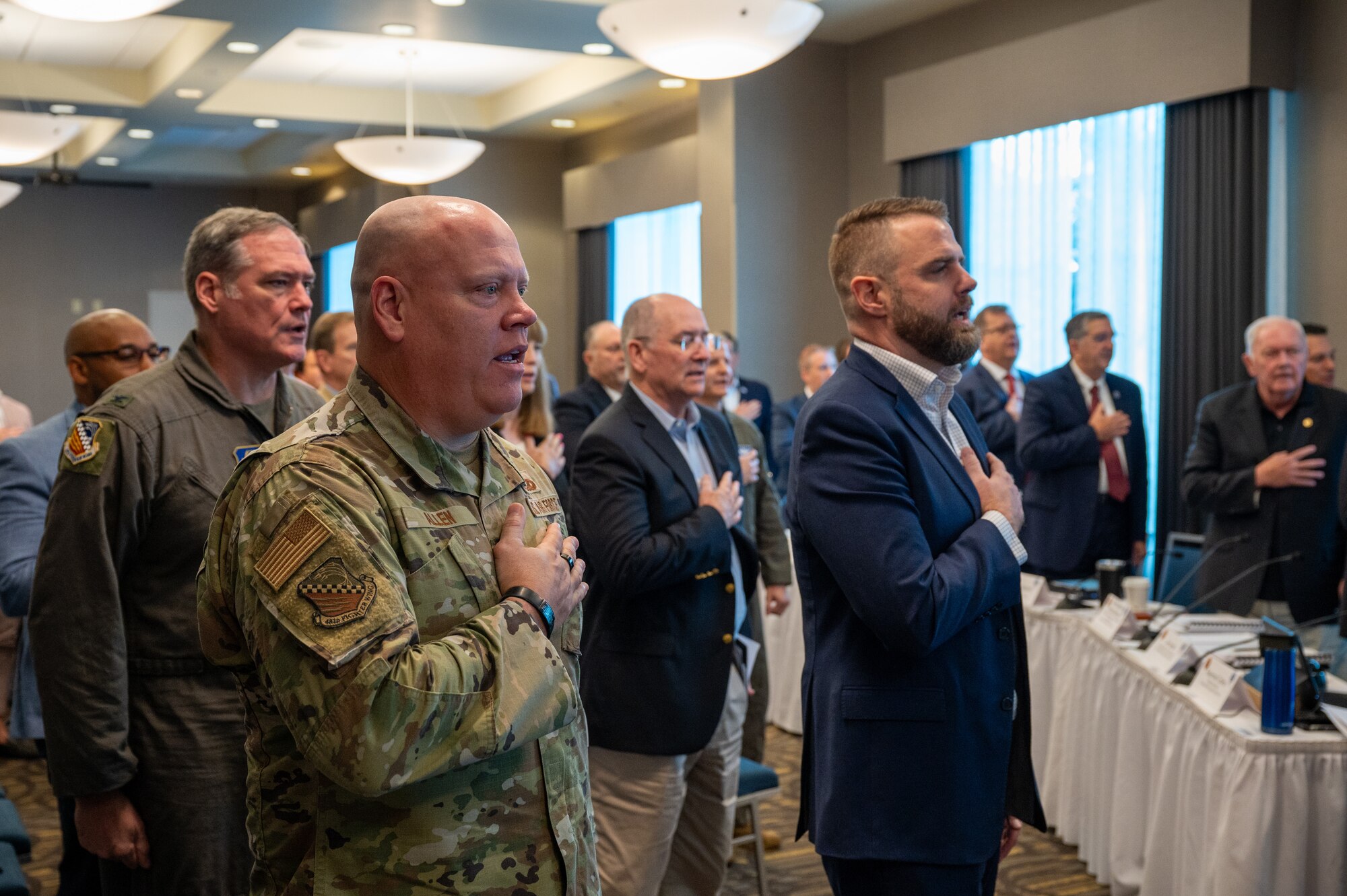 Chief Master Sgt. Jeremy Allen, 482d Fighter Wing Command Chief, leads the pledge of allegiance to open the significant meeting with the Florida Defense Support Task Force in Homestead, Fla. Sept. 21, 2023.