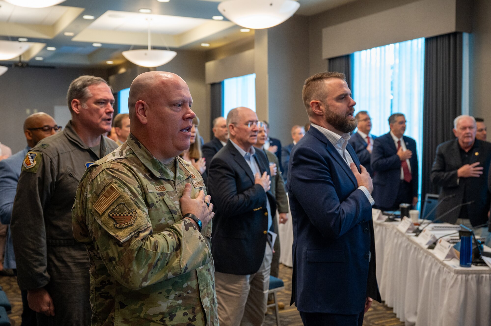 Chief Master Sgt. Jeremy Allen, 482d Fighter Wing Command Chief, leads the pledge of allegiance to open the significant meeting with the Florida Defense Support Task Force in Homestead, Fla. Sept. 21, 2023.