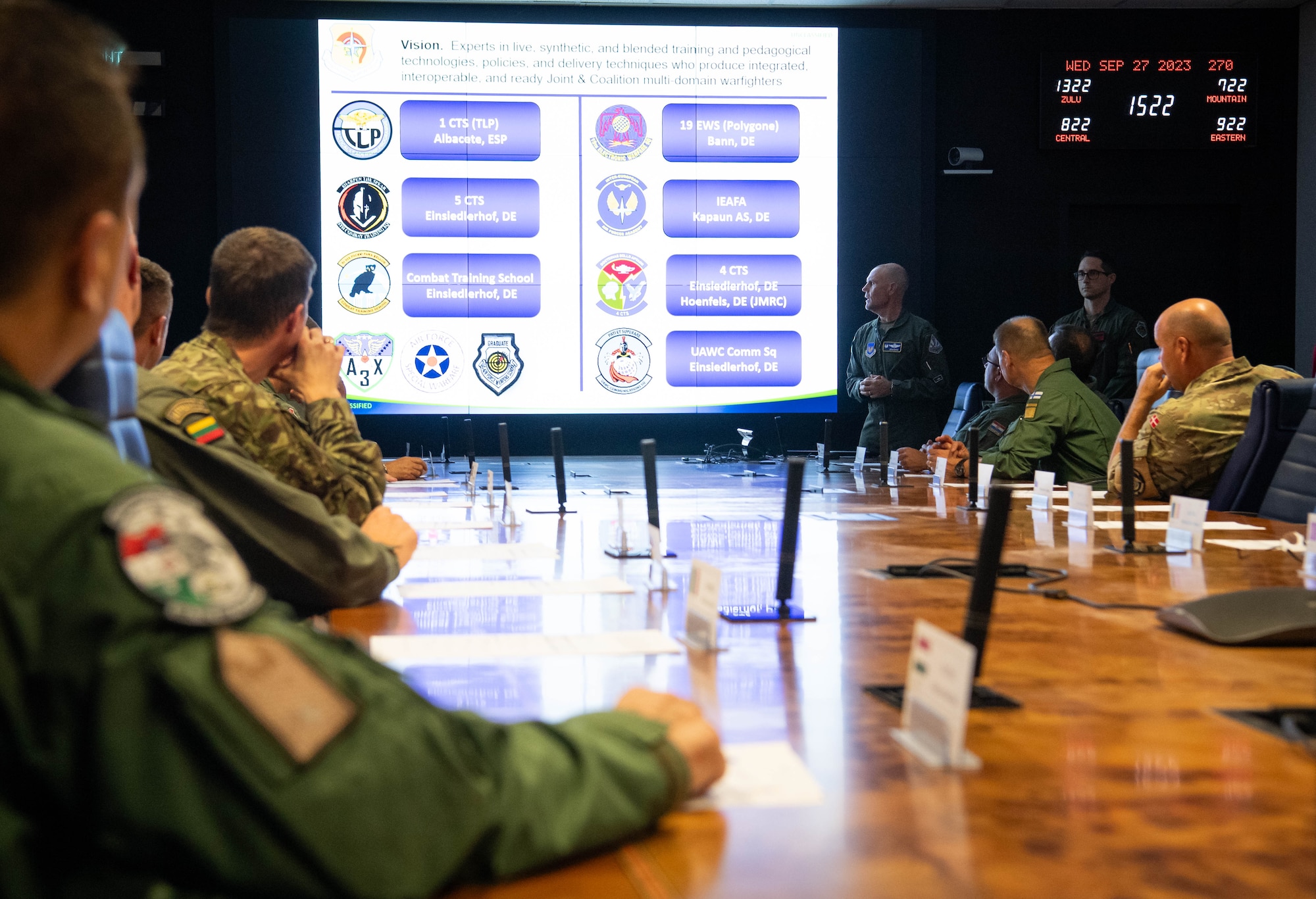 U.S. Air Force Col. Dean Berck, United States Air Forces in Europe, Air Forces Africa Warfare Center (UAWC) commander, provides a mission brief on the UAWC to U.S. Air Force Gen. James B. Hecker, USAFE-AFAFRICA commander, and NATO Air Chiefs at Einsiedlerhof Air Base, Germany, Sept. 27, 2023. The UAWC's mission is to support USAF, Joint, Allied, and partner nation warfighters at the tactical, operational and strategic levels using diverse live, classroom, and modeling and simulation networks. (U.S. Air Force photo by Senior Airman Jared Lovett)
