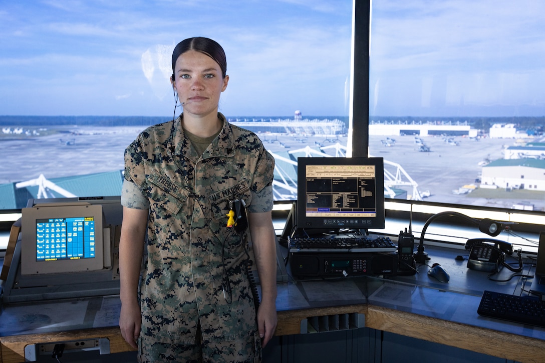 U.S. Marine Corps Cpl. Karli Treese, an air traffic controller attached to Headquarters and Headquarters Squadron, Marine Corps Air Station (MCAS) New River, poses for a photo in the air traffic control tower on MCAS New River, in Jacksonville, North Carolina, Sept. 25, 2023. Treese, the recipient of this month's MCAS New River Go-Getter award, enlisted in the Marine Corps in 2020 from Kansas City, Missouri. (U.S. Marine Corps photo by Lance Cpl. Loriann Dauscher)