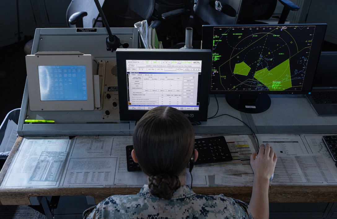 U.S. Marine Corps Cpl. Karli Treese, an air traffic controller attached to Headquarters and Headquarters Squadron, Marine Corps Air Station (MCAS) New River, reviews information on the computer in the air traffic control tower on MCAS New River, in Jacksonville, North Carolina, Sept. 25, 2023. Treese, the recipient of this month's MCAS New River Go-Getter award, enlisted in the Marine Corps in 2020 from Kansas City, Missouri. (U.S. Marine Corps photo by Lance Cpl. Loriann Dauscher)