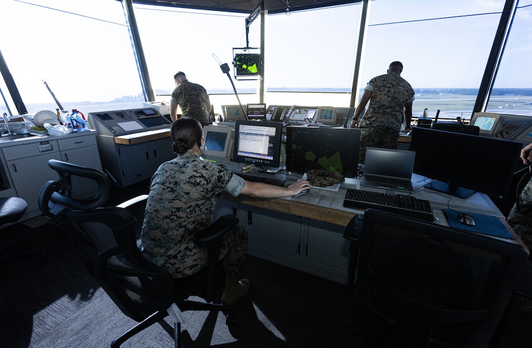 U.S. Marine Corps Cpl. Karli Treese, an air traffic controller attached to Headquarters and Headquarters Squadron, Marine Corps Air Station (MCAS) New River, reviews information on the computer in the air traffic control tower on MCAS New River, in Jacksonville, North Carolina, Sept. 25, 2023. Treese, the recipient of this month's MCAS New River Go-Getter award, enlisted in the Marine Corps in 2020 from Kansas City, Missouri. (U.S. Marine Corps photo by Lance Cpl. Loriann Dauscher)