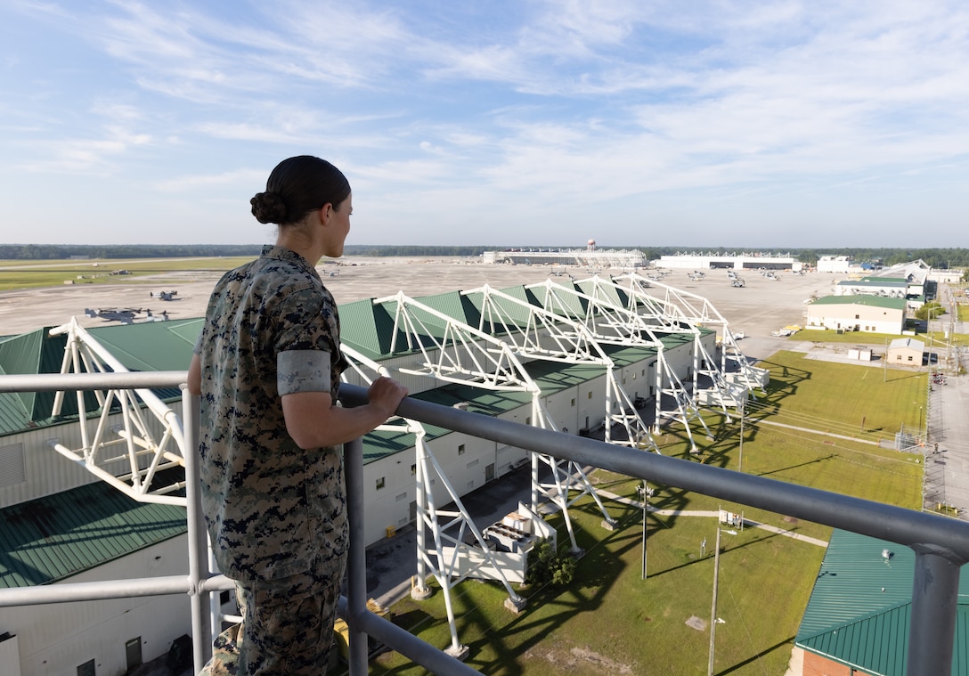 U.S. Marine Corps Cpl. Karli Treese, an air traffic controller attached to Headquarters and Headquarters Squadron, Marine Corps Air Station (MCAS) New River, poses for a photo in the air traffic control tower on MCAS New River, in Jacksonville, North Carolina, Sept. 25, 2023. Treese, the recipient of this month's MCAS New River Go-Getter award, enlisted in the Marine Corps in 2020 from Kansas City, Missouri. (U.S. Marine Corps photo by Lance Cpl. Loriann Dauscher)