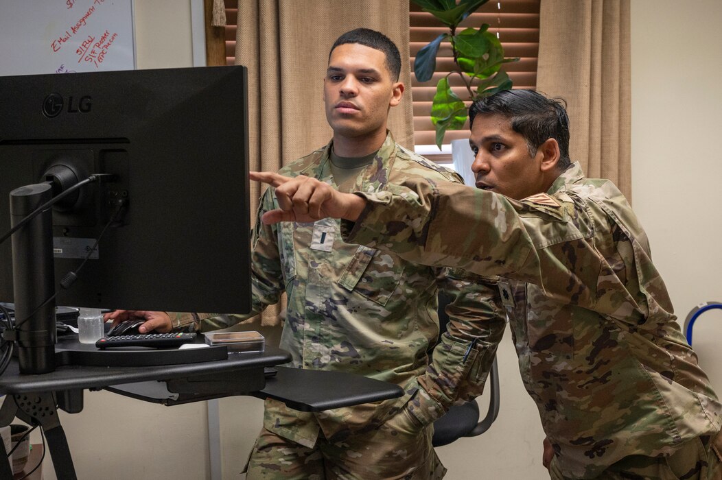 U.S. Air Force 1st Lt. Randy Ocasio, left 51st Comptroller Squadron financial analysis flight commander, and Lt. Col. Brett Ramnarine, 51st CPTS commander, discuss and review wing unfunded requirement requests at Osan Air Base, Republic of Korea, Sept. 15, 2023. Funding provided through the squadron is reflected in every operation within the wing such as funding a $352,500 network management center for the 51st Communications Squadron, to managing the 51st Civil Engineer Squadron’s $42.7 million portfolio which funded over 19 building renovations and recreational areas, while executing $715,000 in flightline repairs and anti-terrorism requirements. (U.S. Air Force photo by Senior Airman Aaron Edwards)