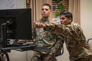 U.S. Air Force 1st Lt. Randy Ocasio, left 51st Comptroller Squadron financial analysis flight commander, and Lt. Col. Brett Ramnarine, 51st CPTS commander, discuss and review wing unfunded requirement requests at Osan Air Base, Republic of Korea, Sept. 15, 2023. Funding provided through the squadron is reflected in every operation within the wing such as funding a $352,500 network management center for the 51st Communications Squadron, to managing the 51st Civil Engineer Squadron’s $42.7 million portfolio which funded over 19 building renovations and recreational areas, while executing $715,000 in flightline repairs and anti-terrorism requirements. (U.S. Air Force photo by Senior Airman Aaron Edwards)