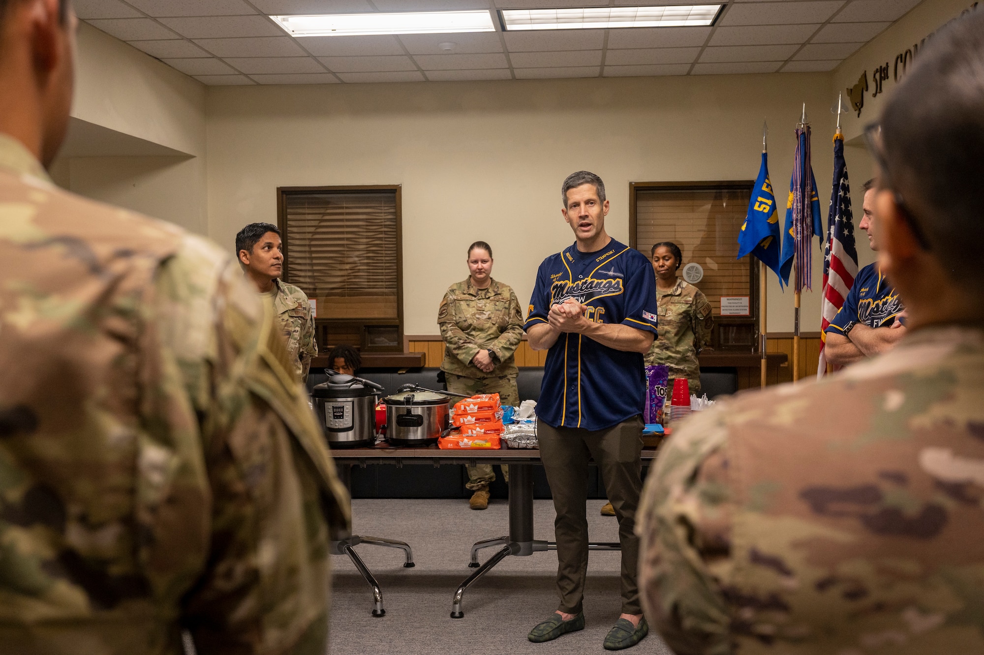 U.S. Air Force Col. William McKibban, 51st Fighter Wing commander, speaks with Airmen from the 51st Comptroller Squadron before a potluck celebrating the fiscal year closeout at Osan Air Base, Republic of Korea, Sept. 30, 2023. This potluck acted as a break for the CPTS Airmen during the FY23 closeout. As these Airmen closed out the fiscal year, it was important to provide breaks, maintaining energy levels and boosting the morale to execute the mission. (U.S. Air Force photo by Senior Airman Aaron Edwards)