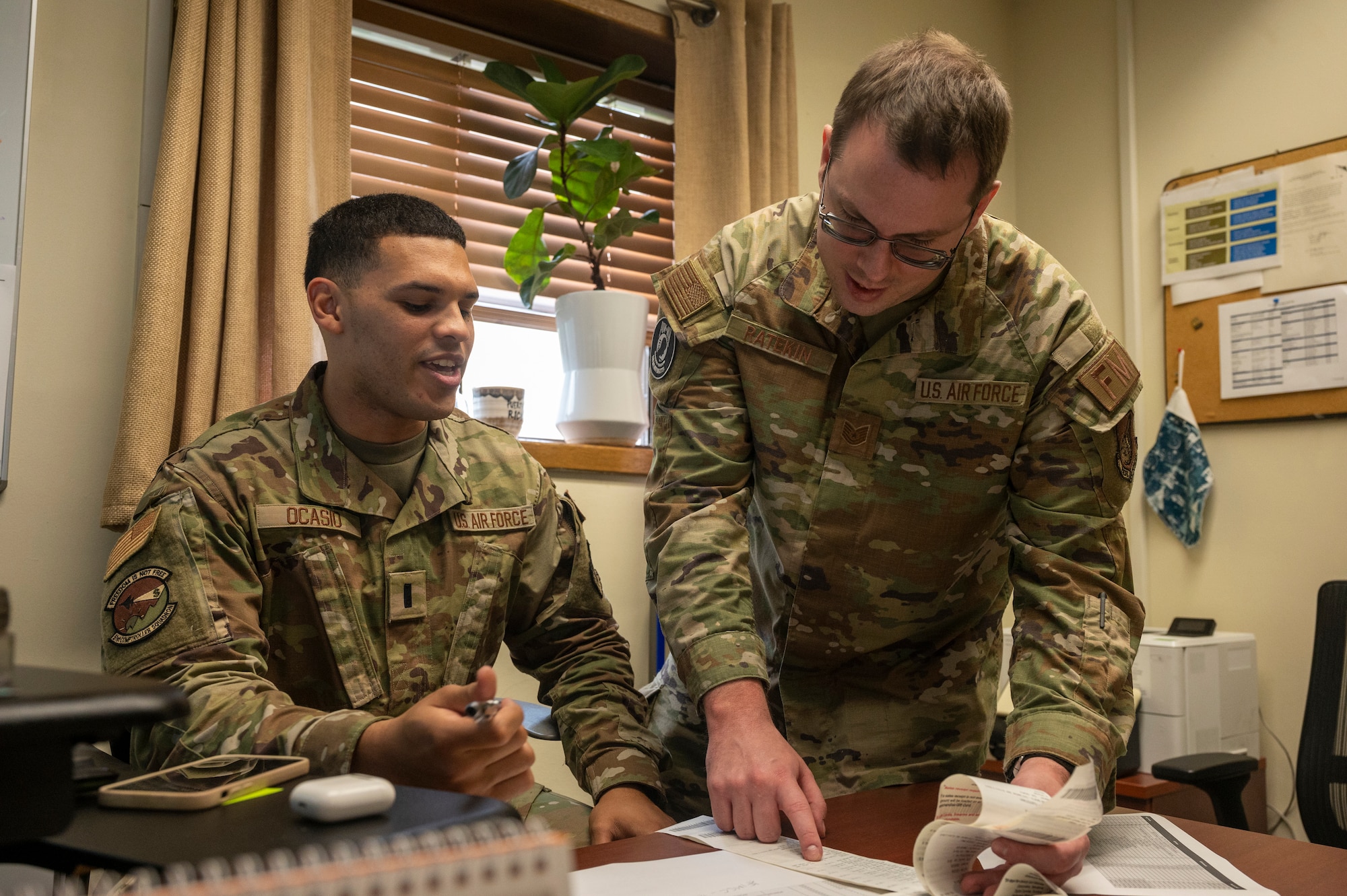 U.S. Air Force 1st Lt. Randy Ocasio, left, 51st Comptroller Squadron financial analysis flight commander, and Tech. Sgt. KC Ratekin, 51st Maintenance Group resource advisor, review receipts at Osan Air Base, Republic of Korea, Sept. 30, 2023. During FY23, the squadron executed $500,000 in spending on cold-weather gear for Airmen in the 51st Maintenance Group and the 51st Security Forces Squadron, keeping them protected and ready to execute the mission. (U.S. Air Force photo by Senior Airman Aaron Edwards)