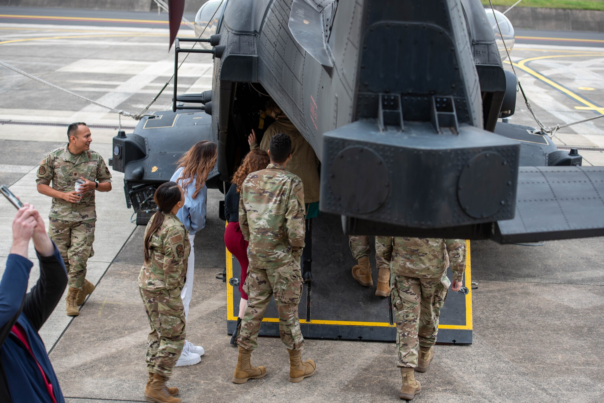 People enter a helicopter.
