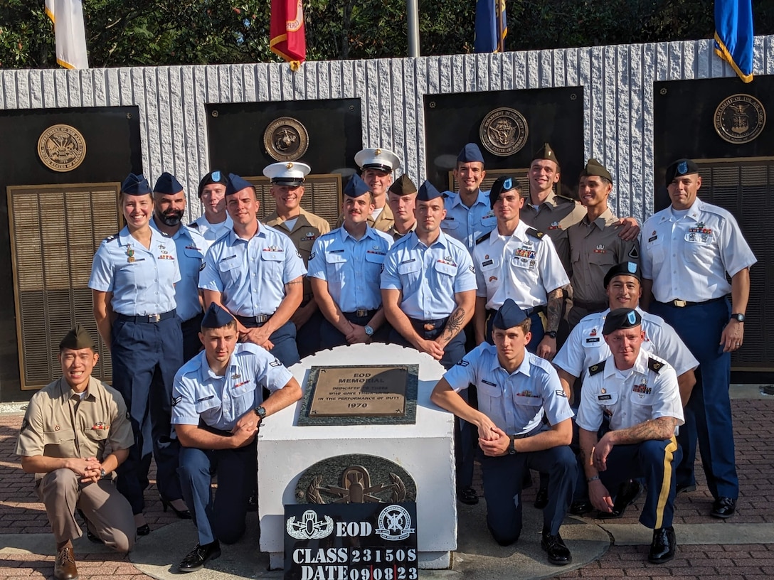 Capt. Natalie Petro stands with her graduating class at the Navy School Explosive Ordnance Disposal in Eglin, Florida.