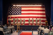 Chief petty officer selectees march on stage during a pinning ceremony at Naval Base Kitsap-Bremerton, Washington Sept. 29, 2023. The rank of chief petty officer was officially established April 1, 1893, and holding the title "Chief" means a Sailor has achieved senior non-commissioned officer status. (U.S. Navy photo by Mass Communication Specialist 3rd Class Sophia H. Bumps)