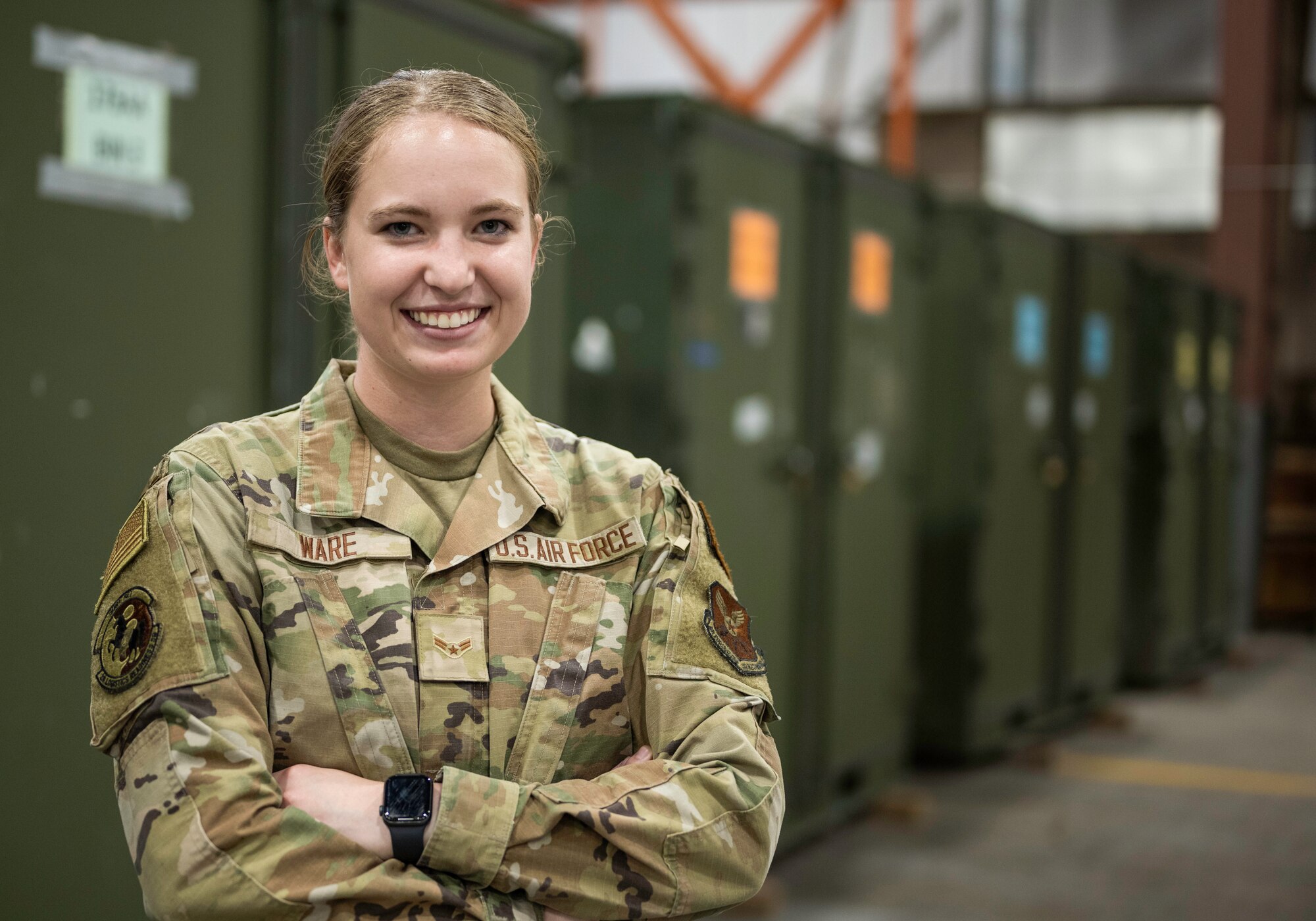 Airman 1st Class Emily Ware, 28th Logistics Readiness Squadron aircraft parts store technician, poses for a photo in the aircraft parts store warehouse on Ellsworth Air Force Base, South Dakota, Aug. 25, 2023.