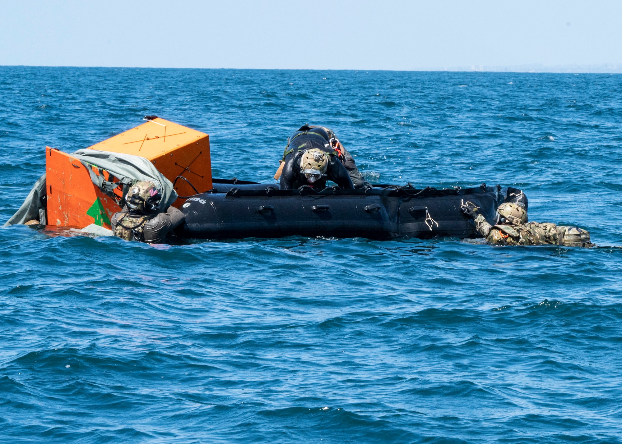 U.S. Airmen, training with the 68th Rescue Squadron, set up a pre-dropped Rigged Alternate Method Boat near San Diego, Calif., Sept. 6, 2023. The Airmen used the RAMB to travel to and rescue simulated casualties. (U.S. Air Force photo by Airman 1st  Class William Finn V)