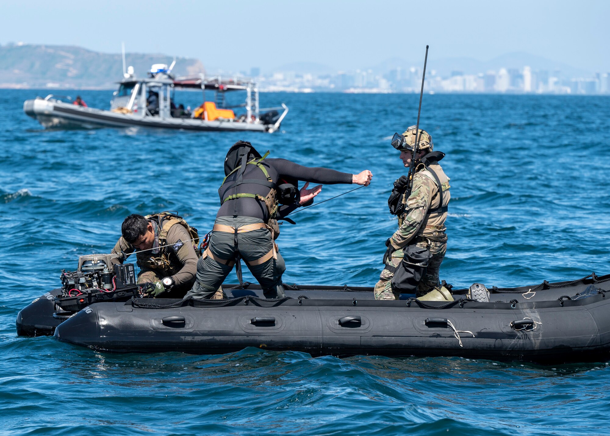 U.S. Airmen, training with the 68th Rescue Squadron, attempt to start a Rigged Alternate Method Boat near San Diego, Calif., Sept. 6, 2023. The Airmen used the RAMB to travel to and rescue simulated casualties. (U.S. Air Force photo by Airman 1st Class William Finn V)