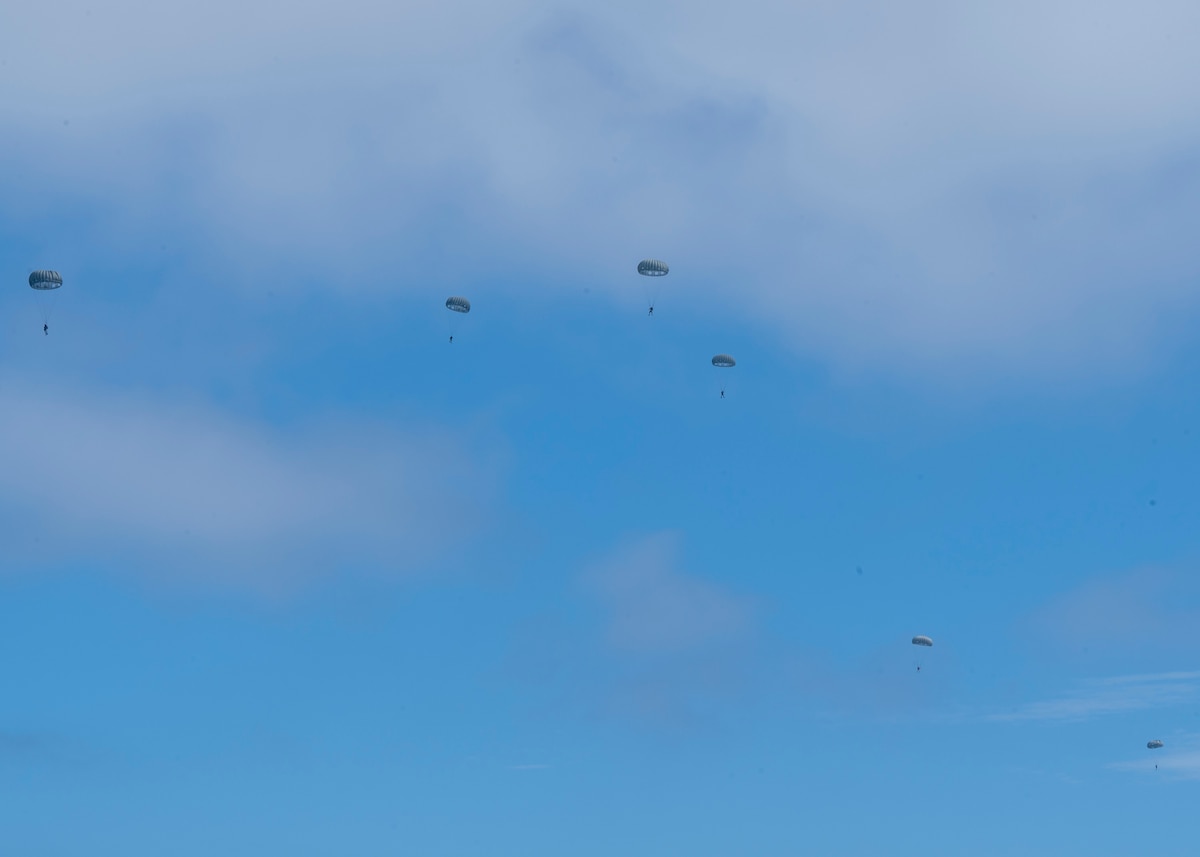 U.S. Airmen, training with the 68th Rescue Squadron, parachute through the sky off the coast of Calif., Sept. 12, 2023. The Airmen participated in the Combat Leader Course, which trained them in multiple rescue skills to include parachuting, providing medical care to simulated casualties and mission planning. (U.S. Air Force photo by Airman 1st Class William Finn V)