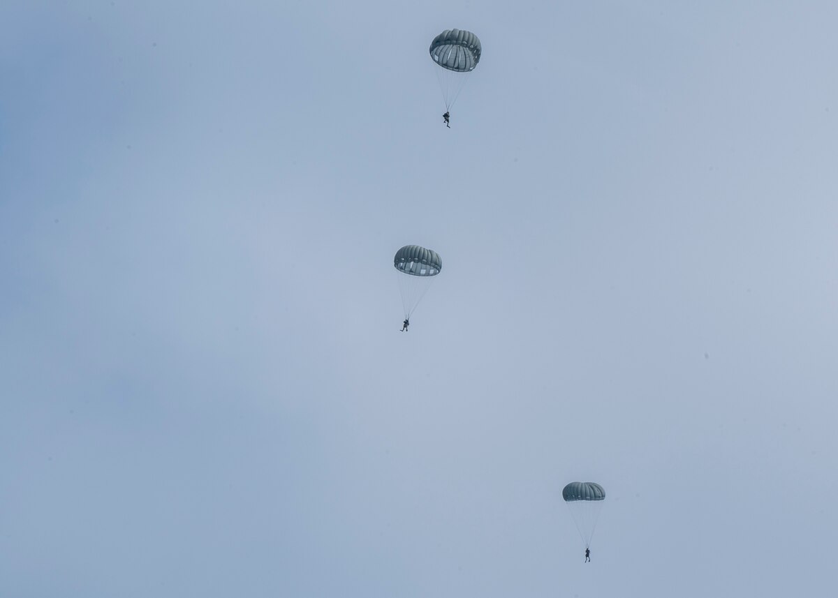 U.S. Airmen, training with the 68th Rescue Squadron, parachute into the ocean off the coast of Calif., Sept. 12, 2023. The Airmen parachuted down to the water, located simulated casualties aboard a boat, provided the casualties with medical care, and engaged with simulated opposition forces. (U.S. Air Force photo by Airman 1st Class William Finn V)