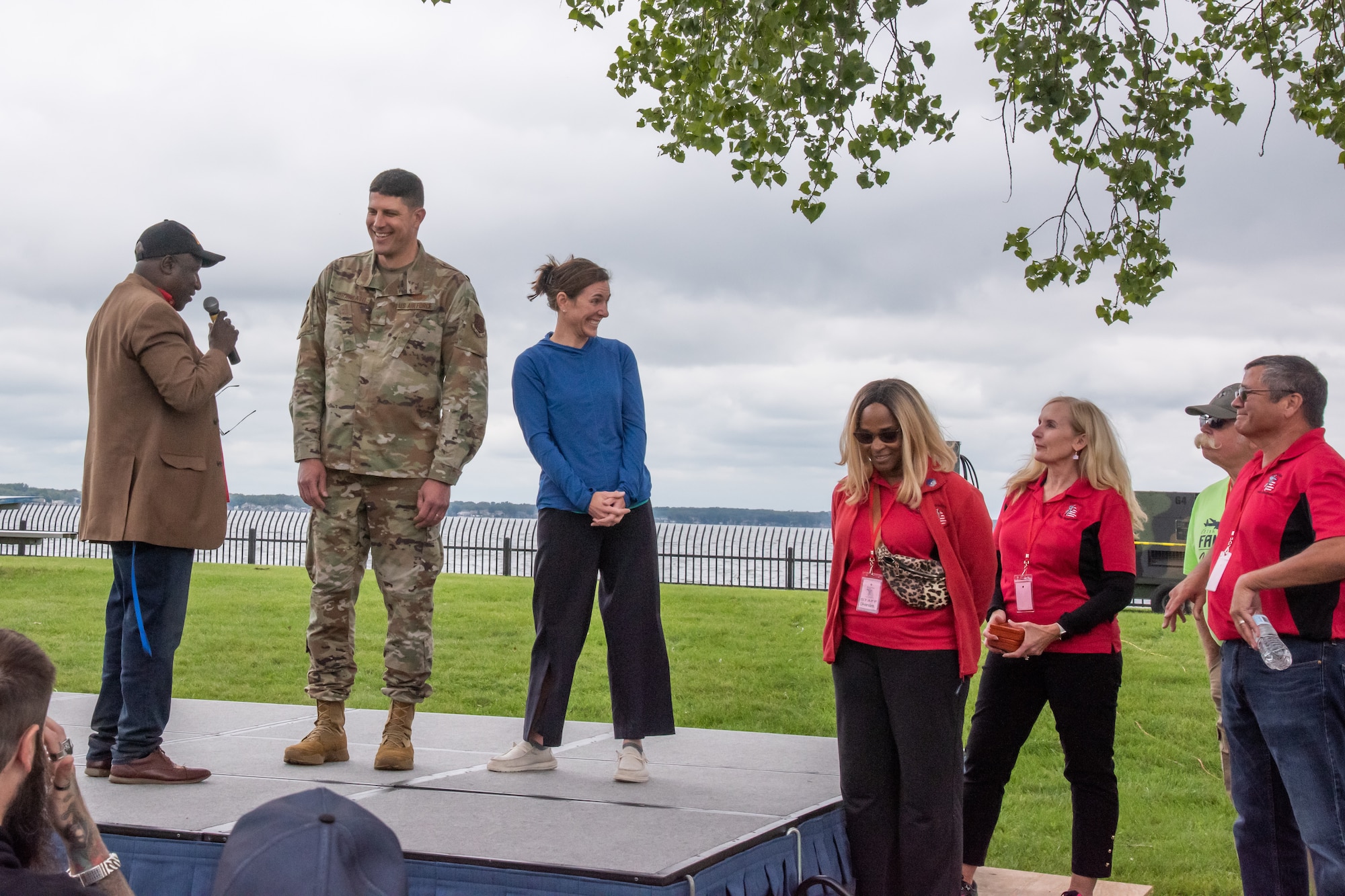 U.S. Air Force Brig. Gen. Matthew Brancato, commander of the 127th Wing, and his wife, Col. Micaela Brancato, 217th Air Operations Group, 110th Wing, Michigan Air National Guard, stand with family readiness group members during the opening ceremony of the Wing's family appreciation day, Selfridge Air National Guard Base, Michigan, Sep. 9, 2023.