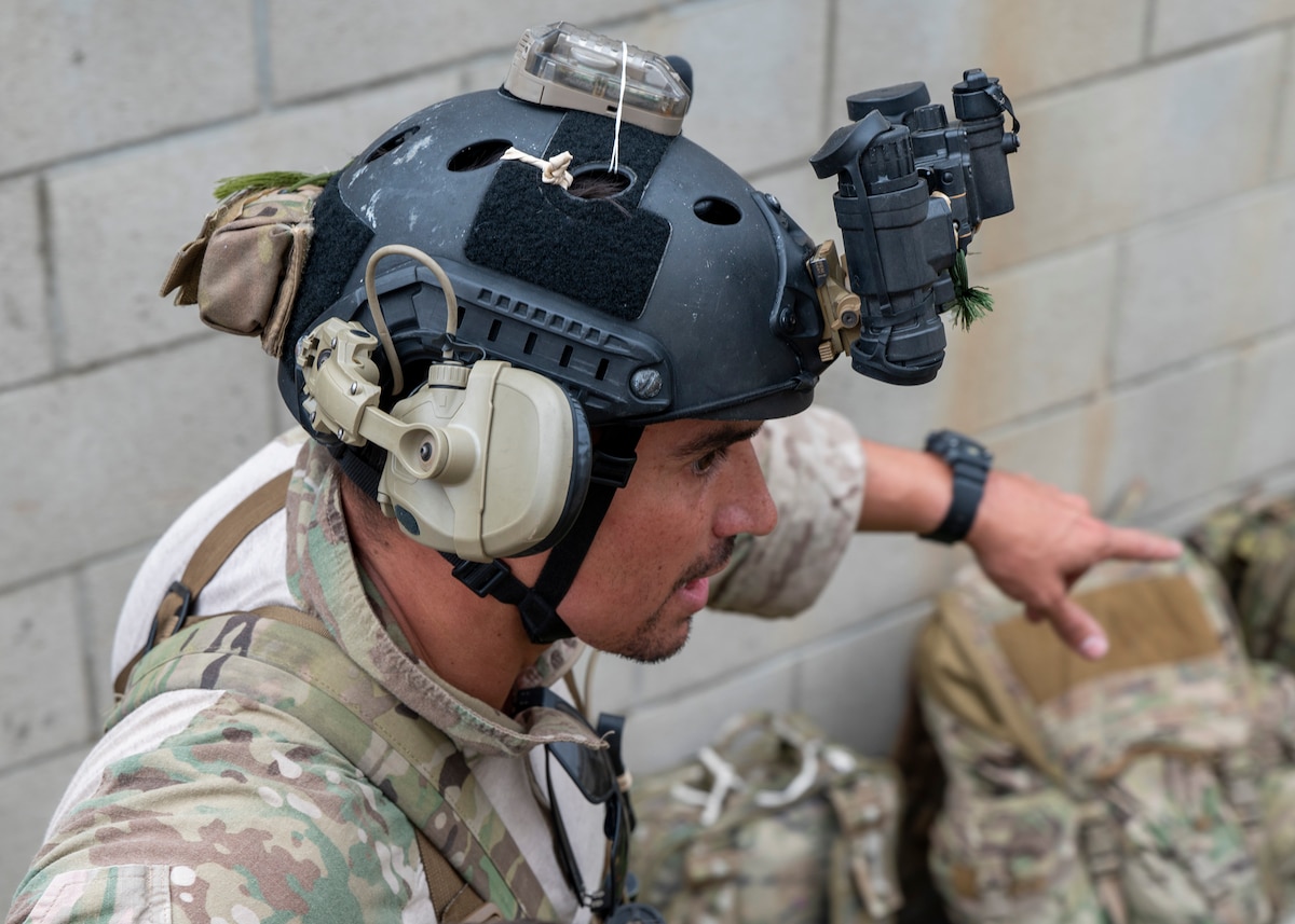 A U.S. Airman, training with the 68th Rescue Squadron, manages a simulated mass casualty event at an UNDISCLOSED LOCATION, Calif., Sept. 17, 2023. The Airman was responsible for protecting and keeping the casualties away from simulated opposition forces and providing them with medical treatment. (U.S. Air Force photo by Airman 1st Class William Finn V)