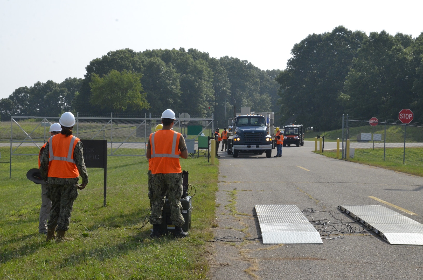 Workers check in a semi truck