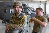 Nebraska Army National Guard Staff Sgt. Kevin Nelson, right, assistant jumpmaster, inspects a parachute worn by Capt. Ben Jochum, 2-134th Infantry Battalion (Airborne) logistics officer, in preparation for a static line jump Sept. 29, 2023, in Lincoln, Neb. Twenty-eight paratroopers of the Nebraska Army National Guard's 2-134th Infantry Battalion (Airborne) completed the jump from a C-17 Globemaster III assigned to the Alaska Air National Guard's 144th Airlift Squadron, 176th Wing.
