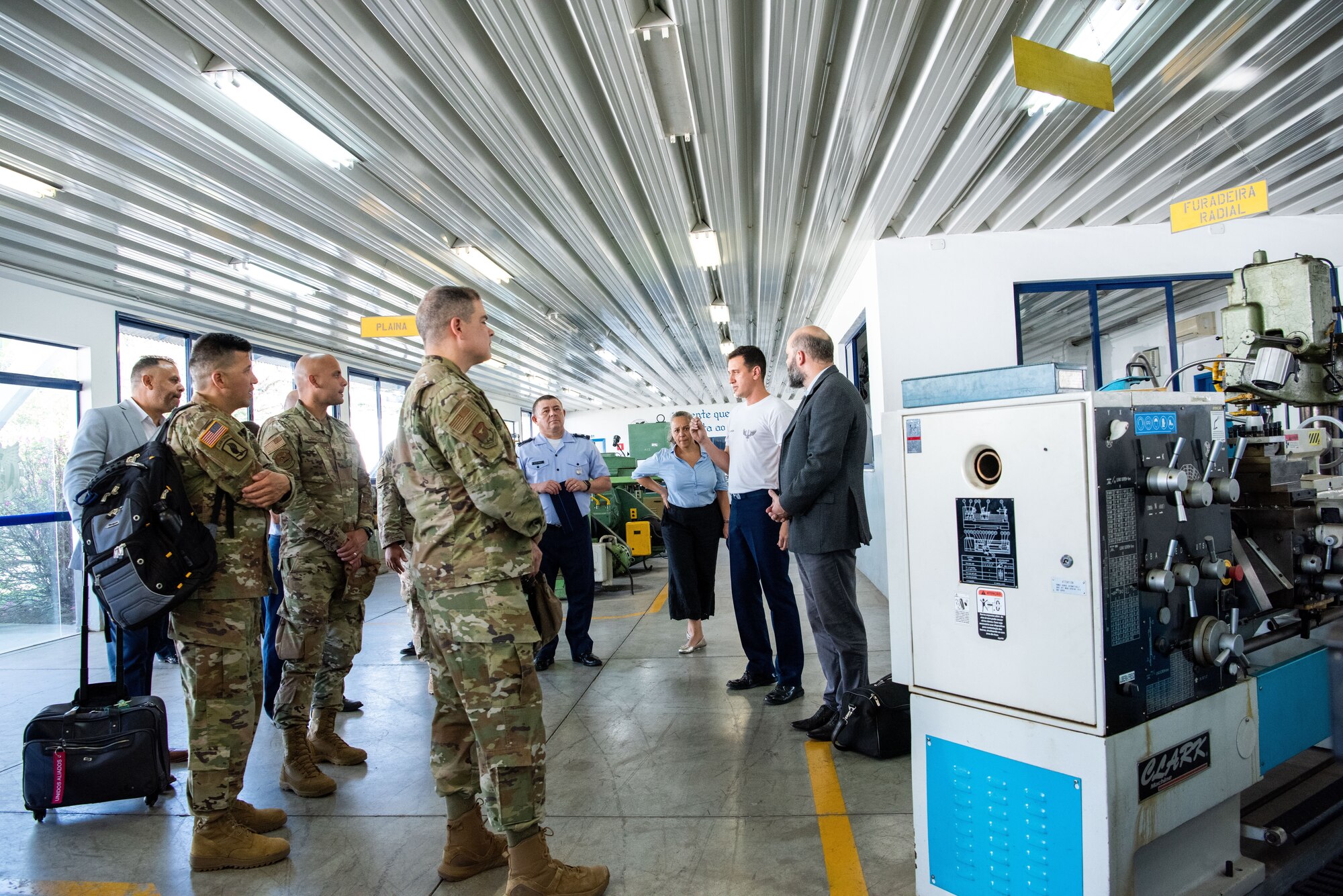 Members of the Inter-American Air Forces Academy and Western Hemisphere Institute for Security Cooperation stand during a tour of the Aeronautics Specialist School in Sao Paolo, Brazil, Aug. 22, 2023. IAAFA led the professional development subject matter expert exchange with the Brazilian Air Force. It was the first visit of its kind in over a decade. (U.S. Air Force photo by Vanessa R. Adame)