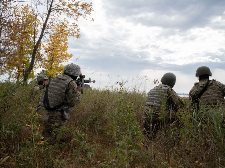 Airmen assigned to the 5th Civil Engineer Squadron prepare for simulated battle at Douglass Creek campgrounds, North Dakota, Sept. 23, 2023. The Airmen took part in an Agile Combat Employment exercise during which they practiced Tactical Combat Casualty Care, land navigation, warfare, and more.